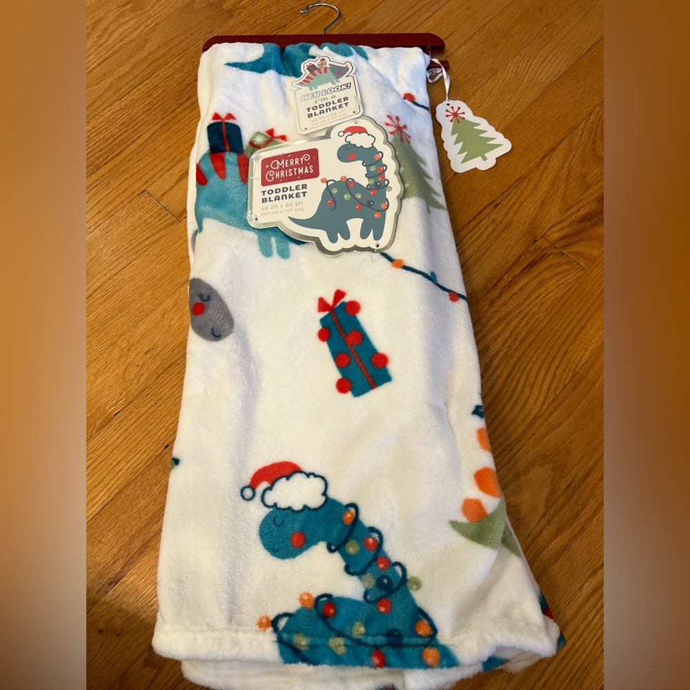 Festive dinosaur super soft blanket